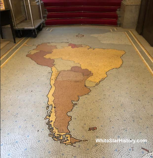  
Mosaic tile floor with map of South America added by Pacific Steam Navigation Company within entrance